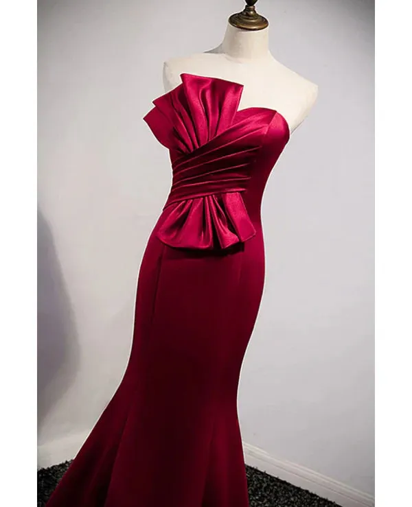 A noble and minimalist wine red sleeveless off shoulder ball dress with strapless backless straps and ground length fishtail evening dress