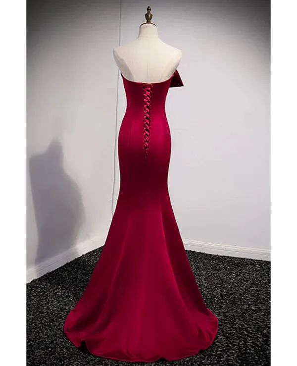 A noble and minimalist wine red sleeveless off shoulder ball dress with strapless backless straps and ground length fishtail evening dress